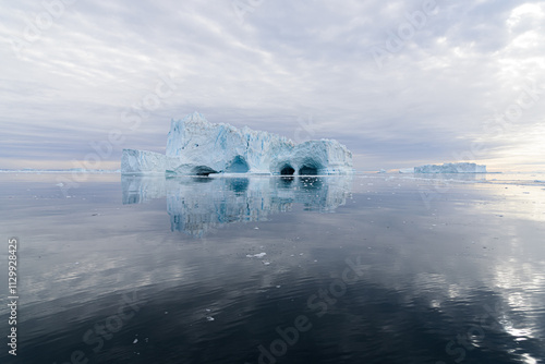 Iceberg with Caves on the Water