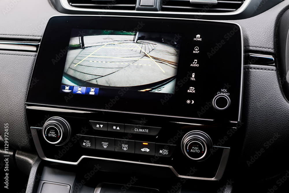 Fototapeta premium Rear view monitor for reversing system Car display and rear view camera parking assistant car navigation.