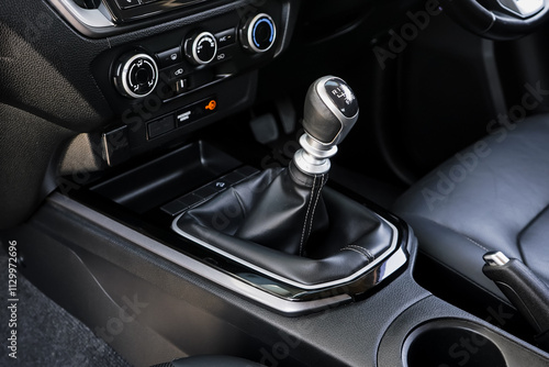 automatic transmission shift selector in the car interior. Closeup a manual shift of modern car gear shifter. 4x4 gear shift