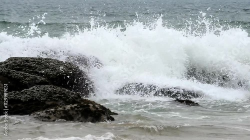 Wallpaper Mural The foam of turbulent waves crashes on the rocks at Kovalam beach in Kerala, India Torontodigital.ca