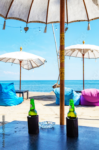 Table with two bottles of beer, Bali, Indonesia, Southeast Asia. photo