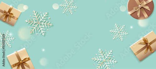 パステルブルーグリーンの背景に雪の結晶とギフトボックスが浮かぶクリスマスデザイン