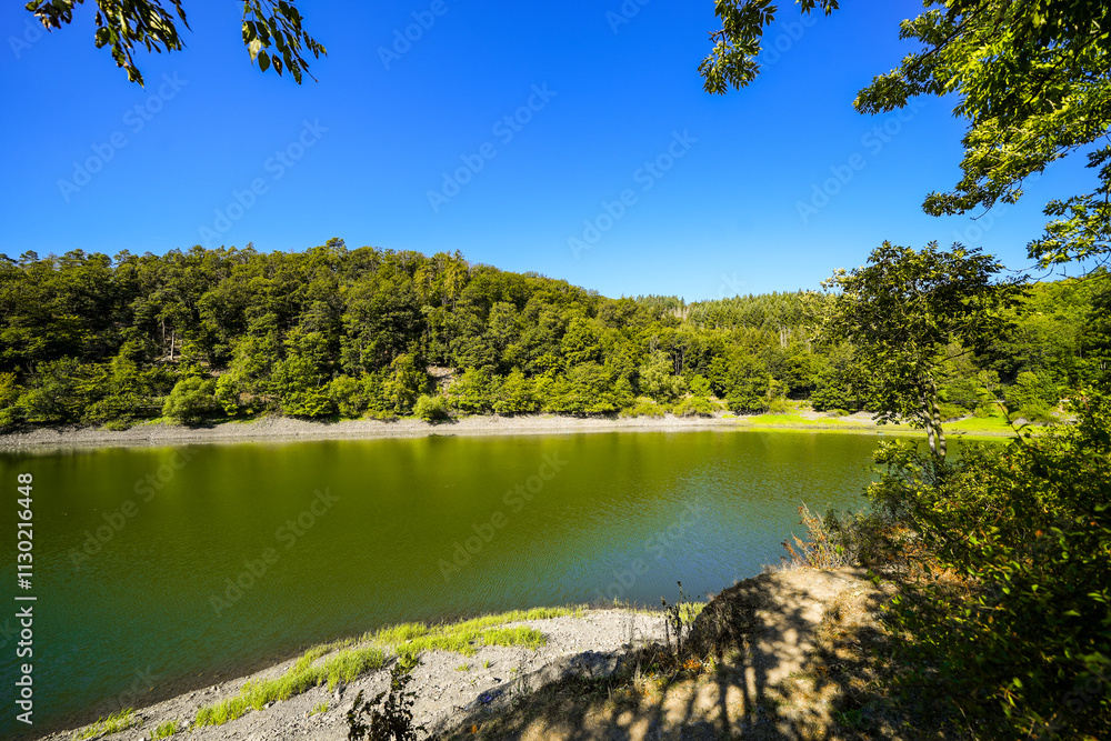 Obraz premium View of the Edersee and the surrounding nature at the lake. Landscape in the Edertal.