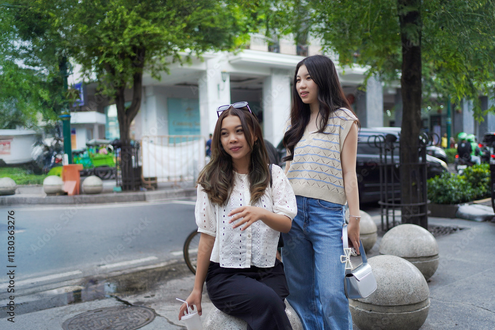 Fototapeta premium two asian women on the street