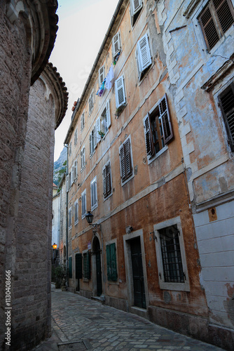 Kotor's narrow cobblestone streets and historic stone houses, a UNESCO World Heritage site. City ​​architecture details.	