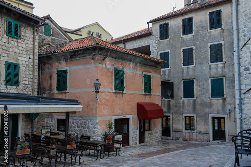 Kotor's narrow cobblestone streets and historic stone houses, a UNESCO World Heritage site. City ​​architecture details.	
