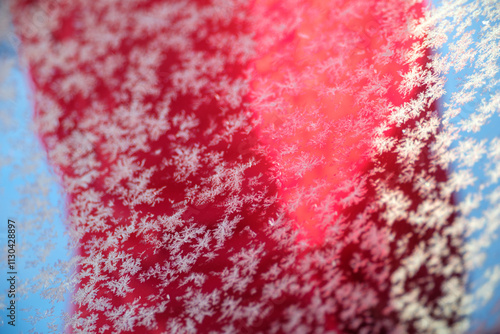 Detailed close-up of intricate snowflakes on a vibrant background in Västanvik, Dalarna, Sweden