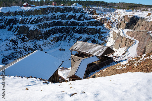 Winter landscape of Falun Mine with snow-covered structures in Dalarna, Sweden