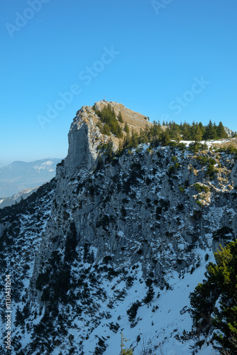 Snow-covered mountain peak in Fischbachau, Bavaria during a clear winter day