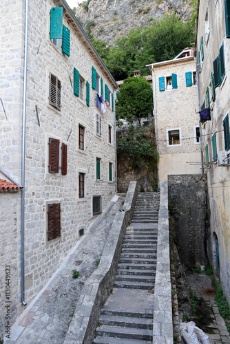 Kotor's narrow cobblestone streets and historic stone houses, a UNESCO World Heritage site. City ​​architecture details.	
