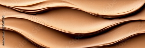 Layers of chocolate mocha mousse in elegant sweeping curves with warm beige highlights, isolated on an empty soft brown background 