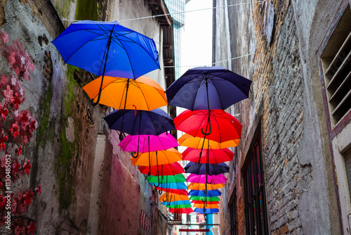 Canvas Print Artistic display of colorful umbrellas hung above an alley in Kuala Lumpur