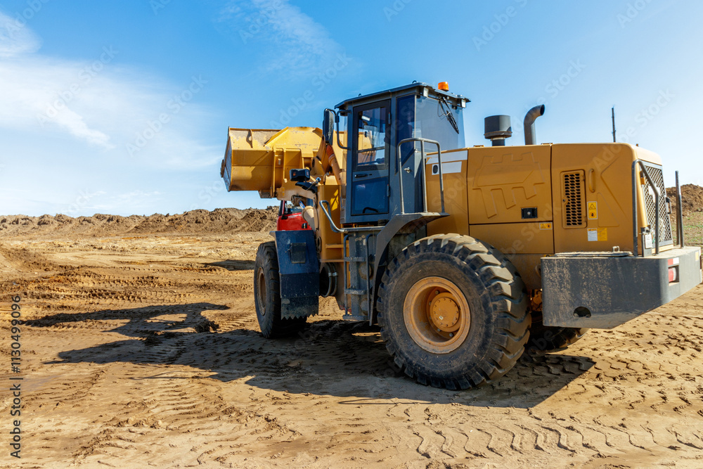 Obraz premium Powerful Construction Bulldozer in Action on Building Site