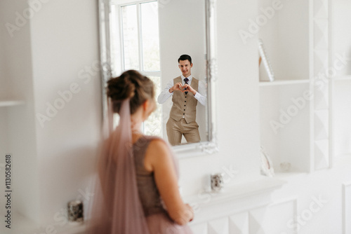 groom in beige suit and bride in lavender wedding tight dress photo