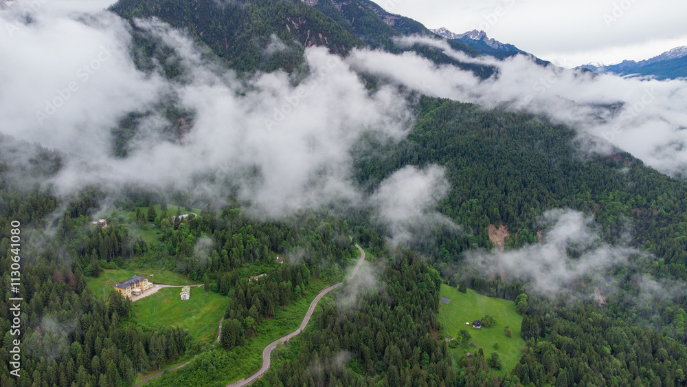 Mountain Serenity: Aerial View of a Scenic Village Amidst Clouds and Peaks Mountain Serenity: Aerial View of a Scenic Village Amidst Clouds and Peaks