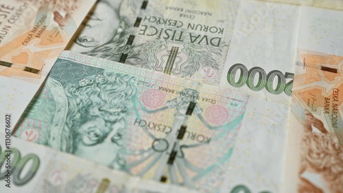 Czech koruna banknotes are laid out closely, highlighting the intricate designs and monetary details specific to the czech republic's currency. photo