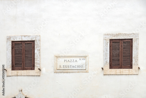 Plaque indicating Piazza Sant'Eustachio on the facade in the historic city center of Rome, Italy photo