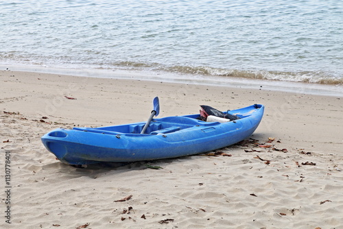 Blue Canoe on the Beach, Changi Beach, Singapore, Asia photo