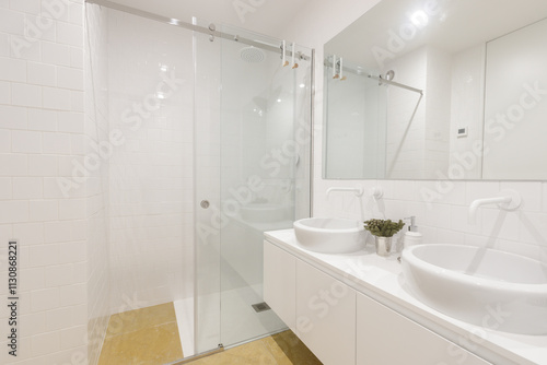 Minimalist bathroom featuring sleek shower.