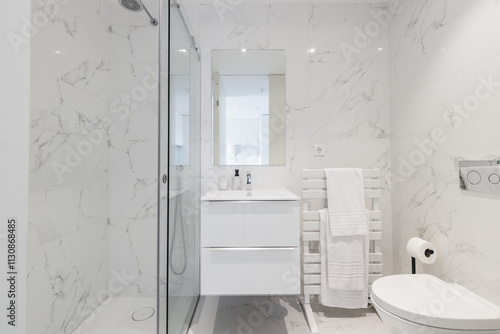 Minimalist bathroom featuring sleek shower.