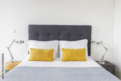 Cozy, modern bedroom with relaxing, bright atmosphere.