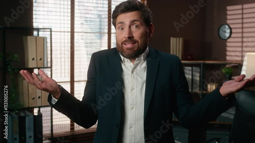 Portrait at office confused puzzled Caucasian man business male employer company CEO businessman guy looking at camera spread hands shrug shoulder unsure dont know hesitate shrugging hesitation