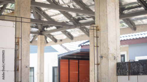 Wallpaper Mural Reinforcing the structure with steel bars for making door frames with cement and laying lightweight bricks. House construction concept Torontodigital.ca