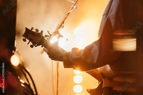 Guitarist at a concert, musician playing instrument photo