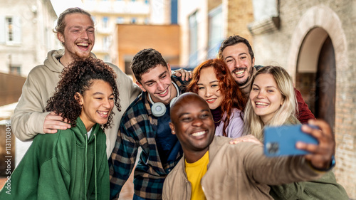 Canvas Print Happy tourists group taking selfie photo walking in european city street - Multi