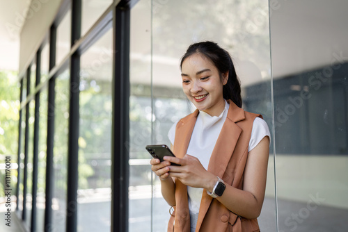 Young woman engaged with smartphone modern office space portrait bright environment casual viewpoint digital interaction Free Download Young woman engaged with smartphone modern office space portrait bright environment casual viewpoint digital interaction - GFXLoad