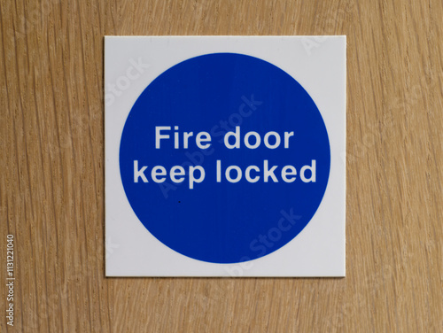 Sign with fire door keep locked on door