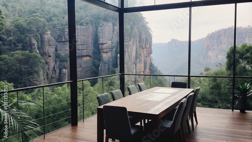 A stylish dining area features a reclaimed wood dining table surrounded by sleek chairs with one wall completely made of glass providing an aweinspiring backdrop of steep cliffs