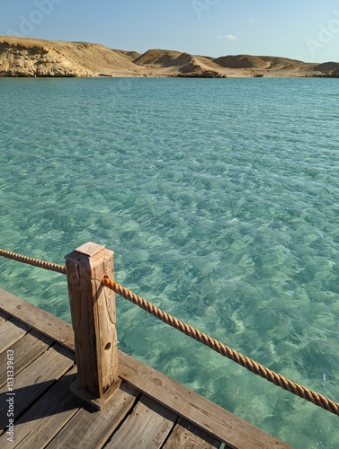 Pier with crystal clear sea water on red sea egypt photo