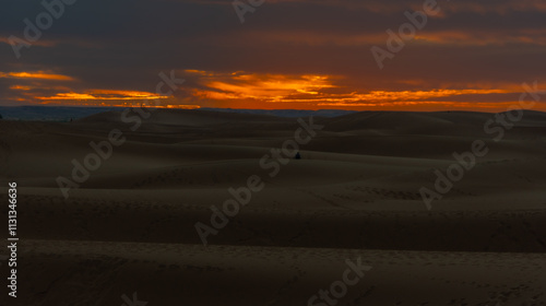 Sunset in the dunes of Chegaga in Morocco, Sahara desert photo