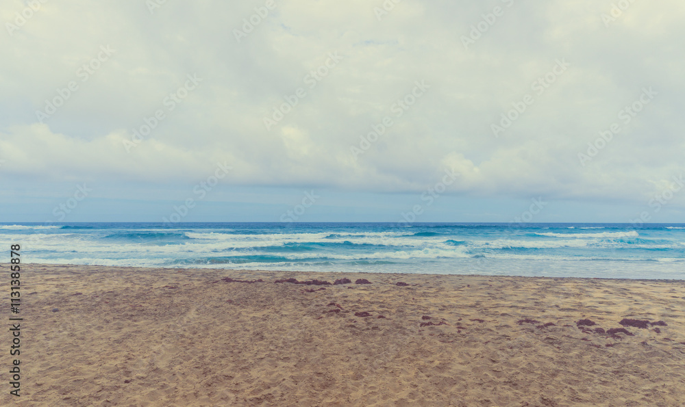 Fototapeta premium Amazing Playa de Cofete beach with endless horizon. Volcanic mountains and Atlantic Ocean. Cofete beach, Fuerteventura, Canary Islands, Spain.