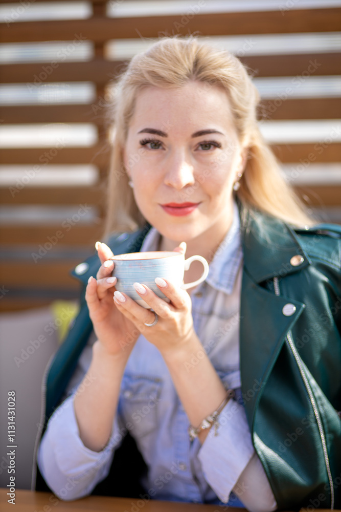 Woman in a caf drinking coffee Woman in a caf drinking coffee