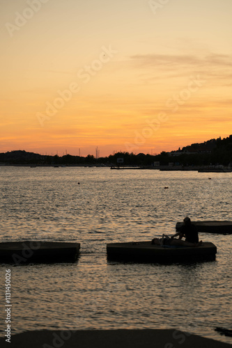 sunset, water, reflection, romance, couple, silhouette, peaceful, lake, evening, relaxing, nature, scenic, stillness, beautiful, quiet, atmosphere, companionship, intimate, harbor, bonding, photo