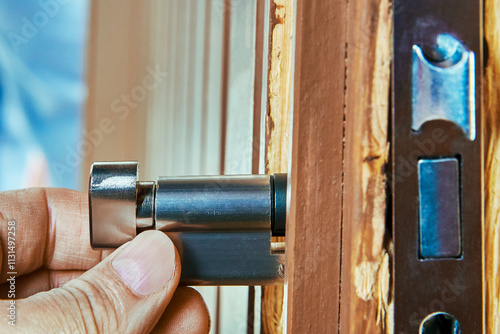 Built in cylinder of door mortise lock is inserted into housing of internal mechanism during installation.