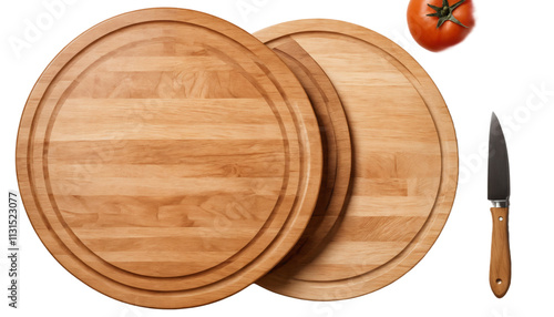 Two light brown wooden round cutting boards, a tomato, and a knife photo