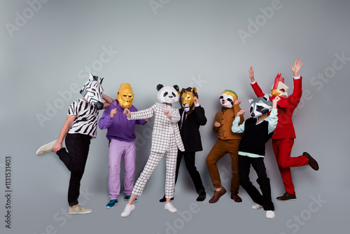 Full body portrait of zebra gorilla raccoon lion panda sloth rooster mask people dance rejoice isolated on grey color background photo