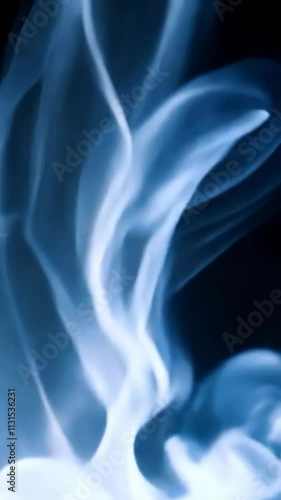 Abstract smoke swirls in blue tones, creating a sense of mystery and elegance. Perfect for creative or atmospheric concepts with ample copy space for text overlays.