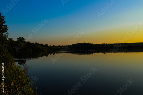 Warm sunlight reflections on the river at dusk, capturing the essence of peace and inspiration photo