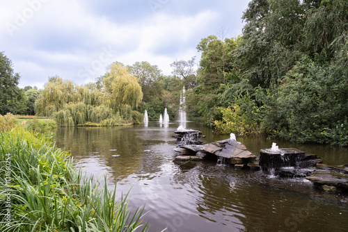 Pond with stones and fountains in the Vondelpark in Amsterdam. photo