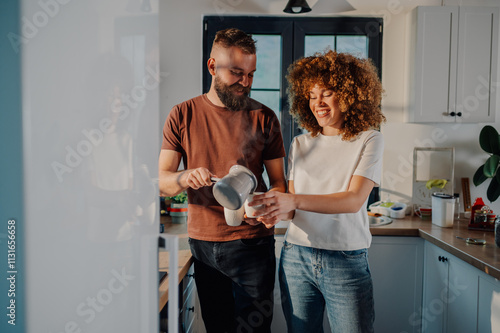 Фотография Happy couple enjoying morning coffee ritual in kitchen