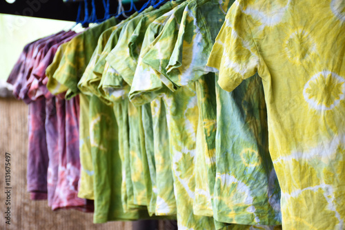 Wallpaper Mural Traditional Japanese fabric dyeing uses fresh plant leaves to create colorful, unique, and handmade patterns and designs. T-shirts decorated with shibori technique. Torontodigital.ca