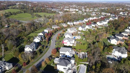 Quarters of modern upper and middle class detached houses.  Autumn landscape from a drone.