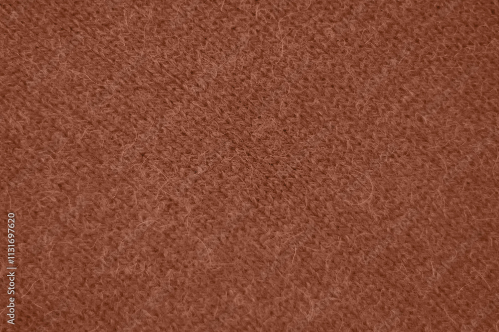 Fototapeta premium Mocha Mousse toned colour monochrome texture knitted fabric. Knitted Jersey as textile background. Monochrome color background. Wool knitting texture. Trendy color 2025.