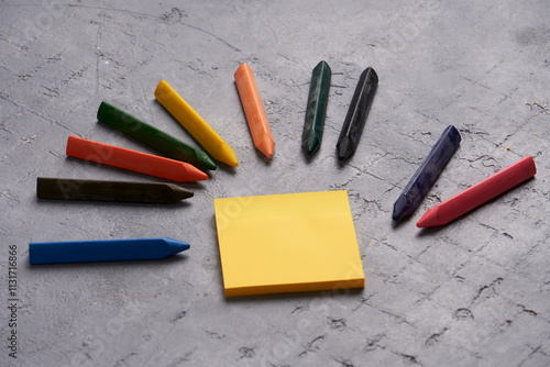 Quadro su tela On a workspace, crayons and sticky notes represent creativity, organization, and planning