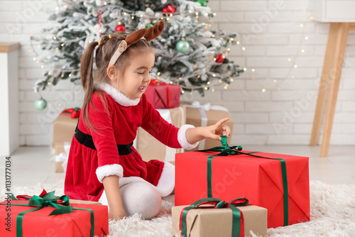 Cute little girl in Santa c...