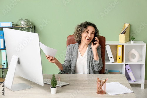 Smiling businesswoman talki...
